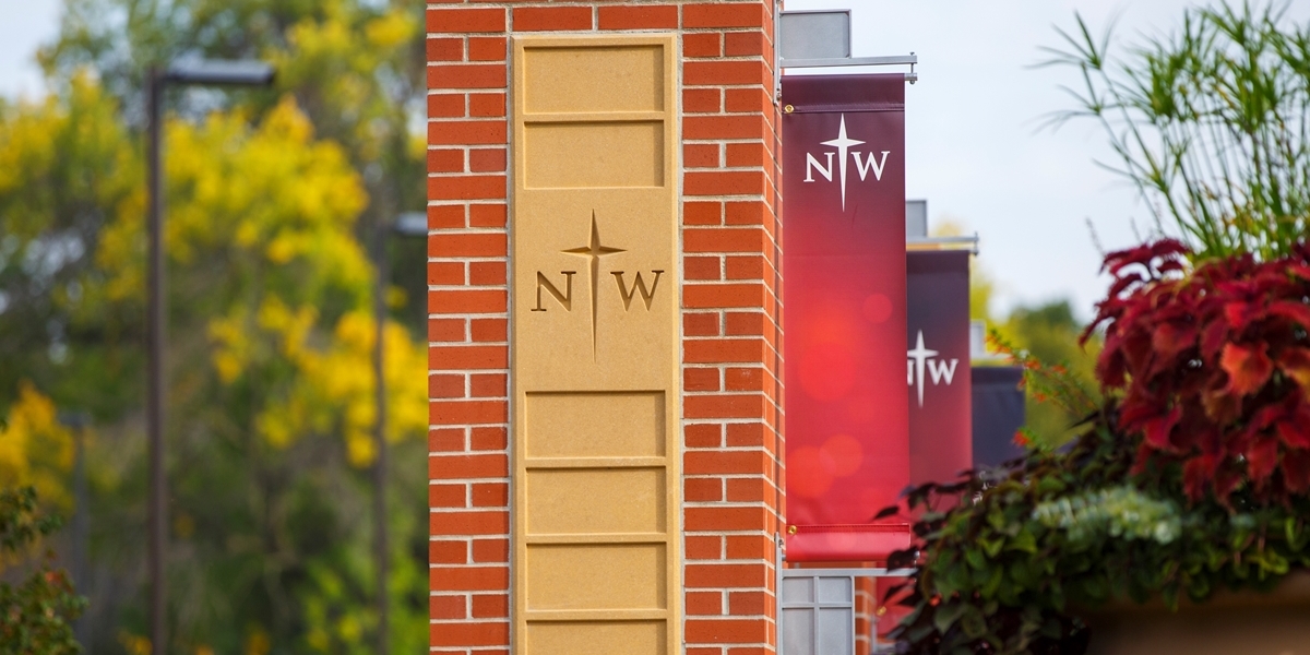 Brick column with Northwestern College banner attached.