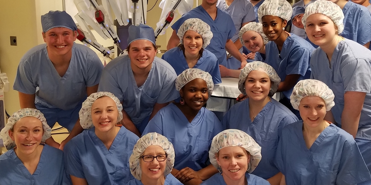 Northwestern students wear scrubs while on a field trip to Avera Hospital