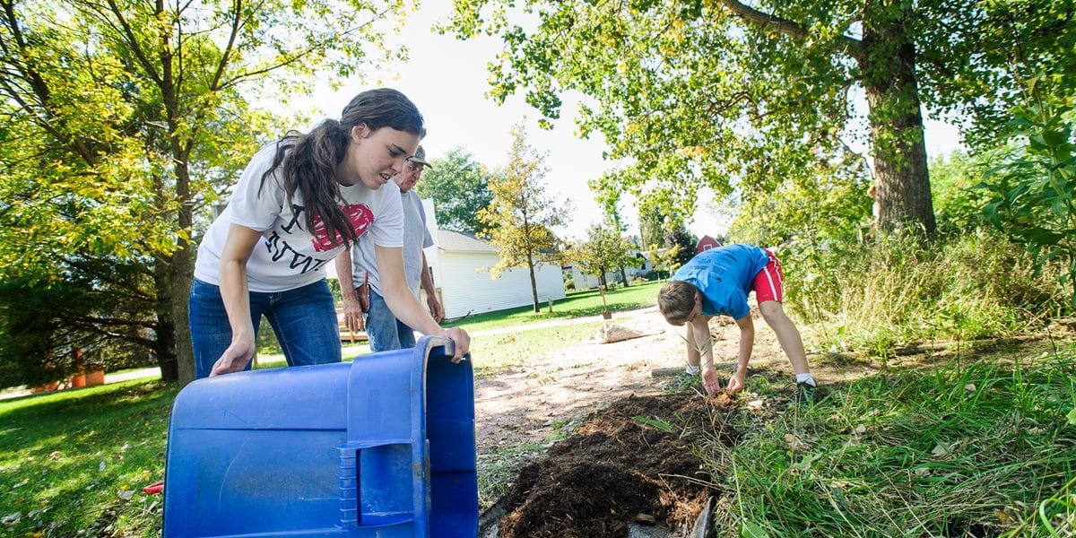 Northwestern students help with landscaping as part of their service-learning experience.