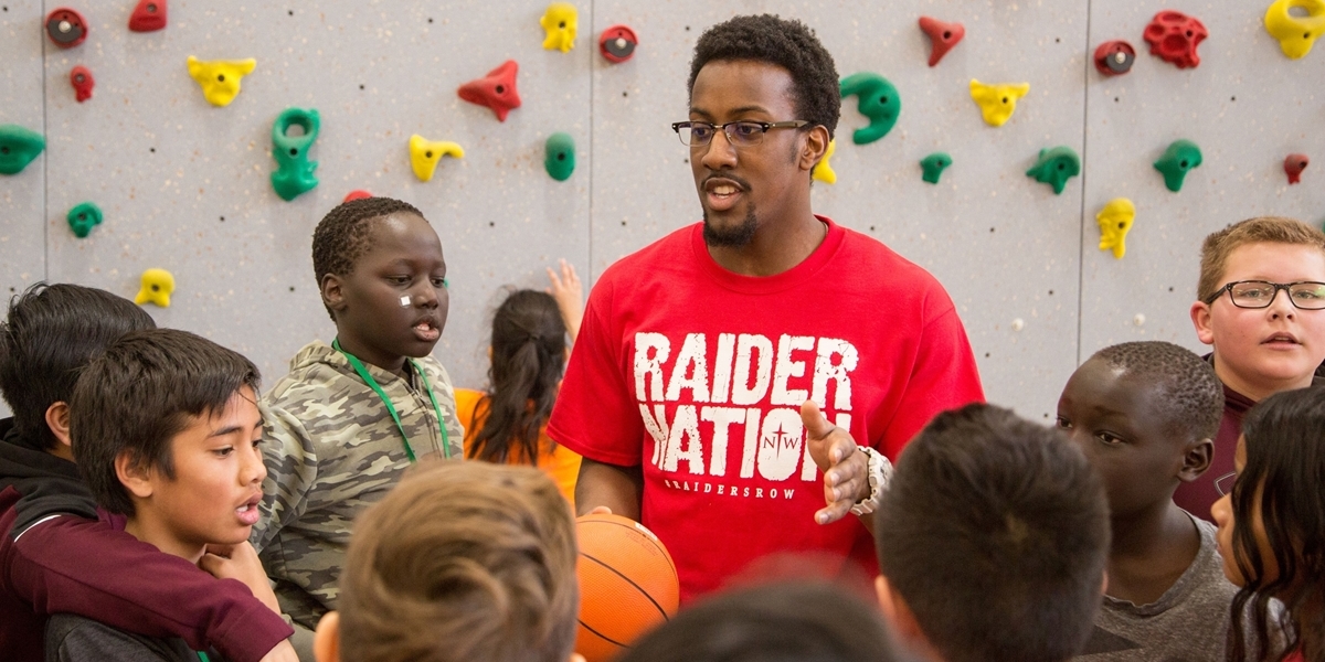 A Northwestern College alum leads a physical education class in Storm Lake, Iowa.