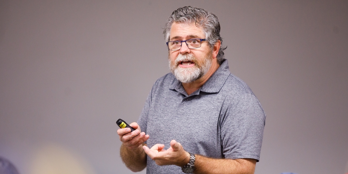 Psychology professor Laird Edman lectures in class.