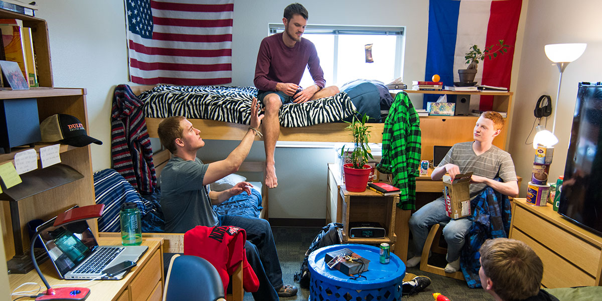 students hanging out in a dorm room