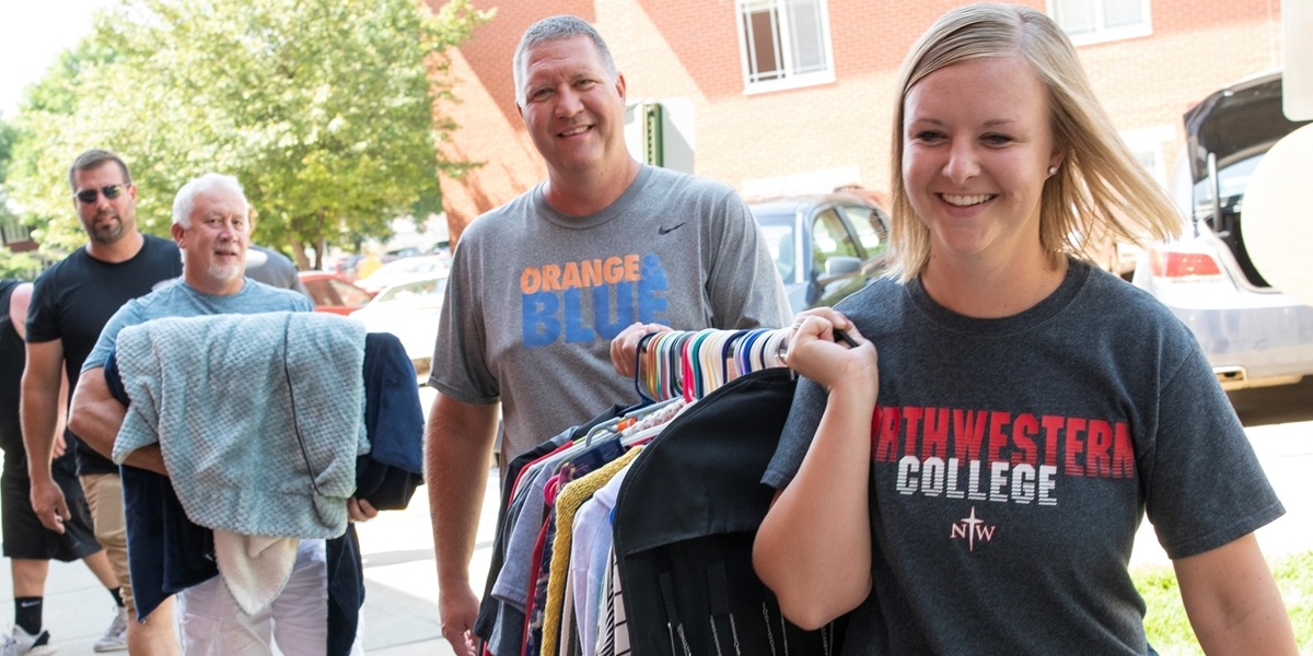 Student moving into a dorm room