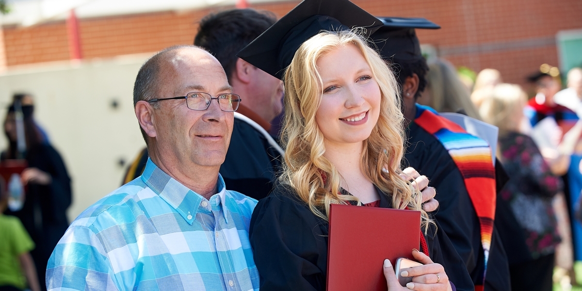 Student with family member at commencement