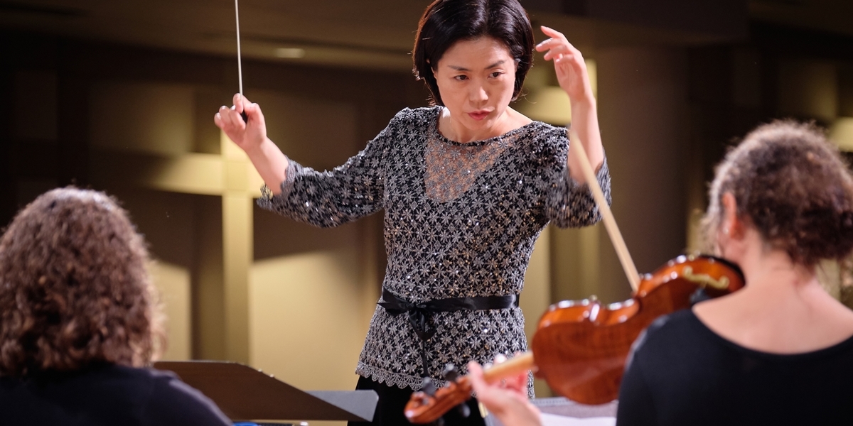 Dr. Juyeon Kang directs the Orchestra.