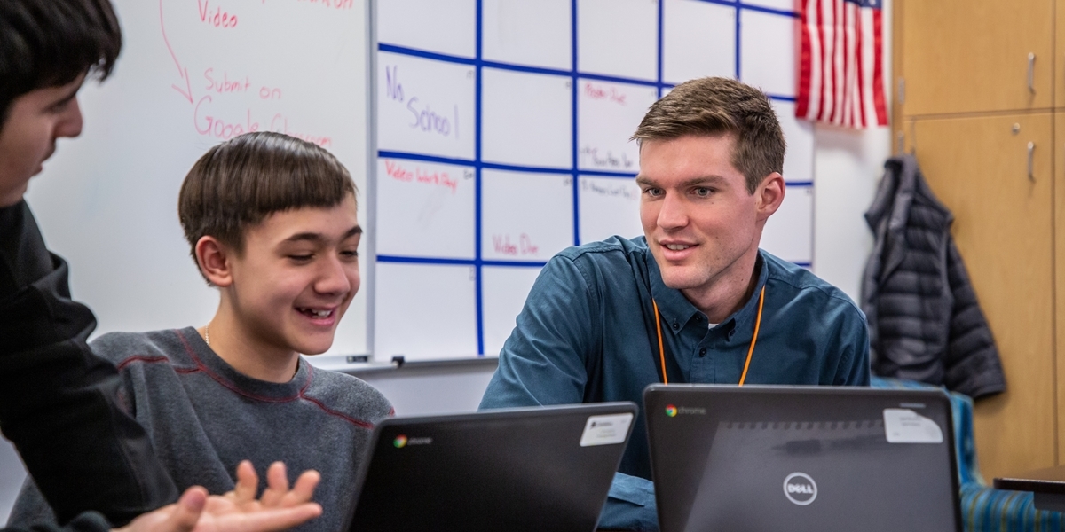 A student teacher works with middle school students.