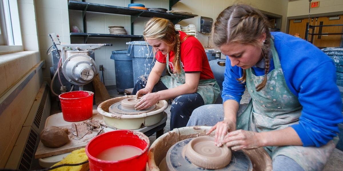 Students working with clay