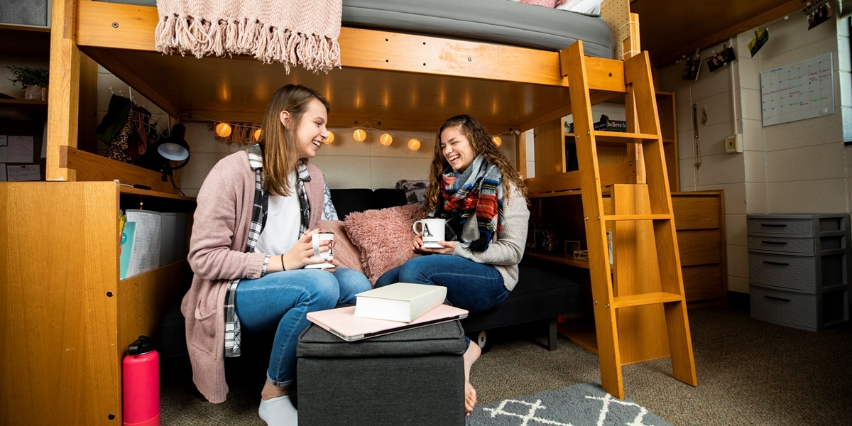 Students talking in a Fern Smith Hall dorm room