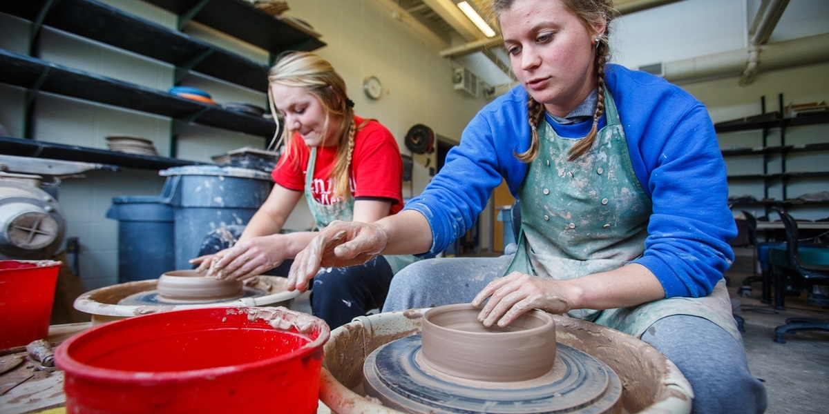 Students use pottery wheels in the Korver Visual Arts Center.