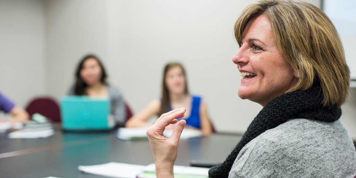 A Northwestern professor lectures during class.