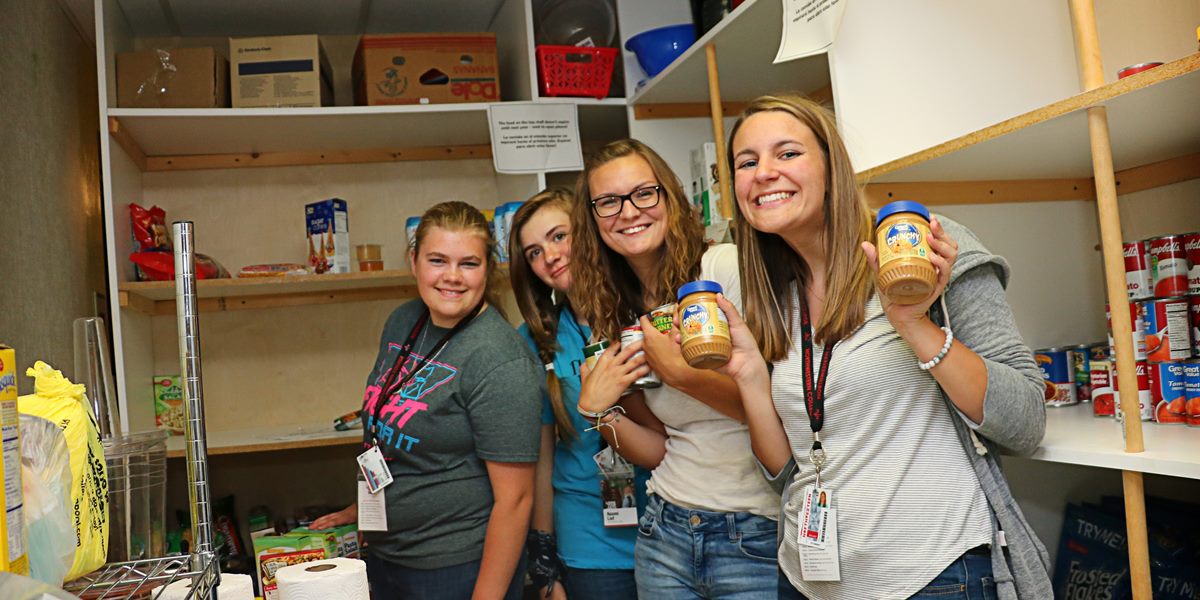 Students help stock a local food bank.